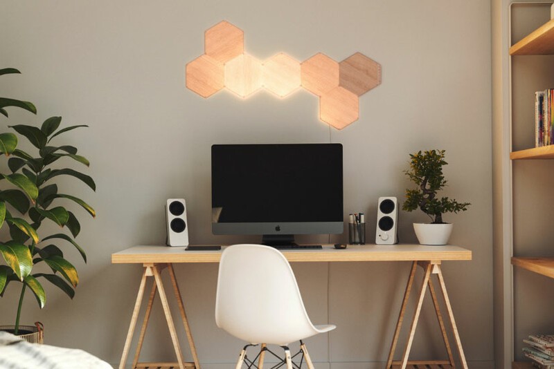 Nanoleaf Elements lights positioned above a desk.